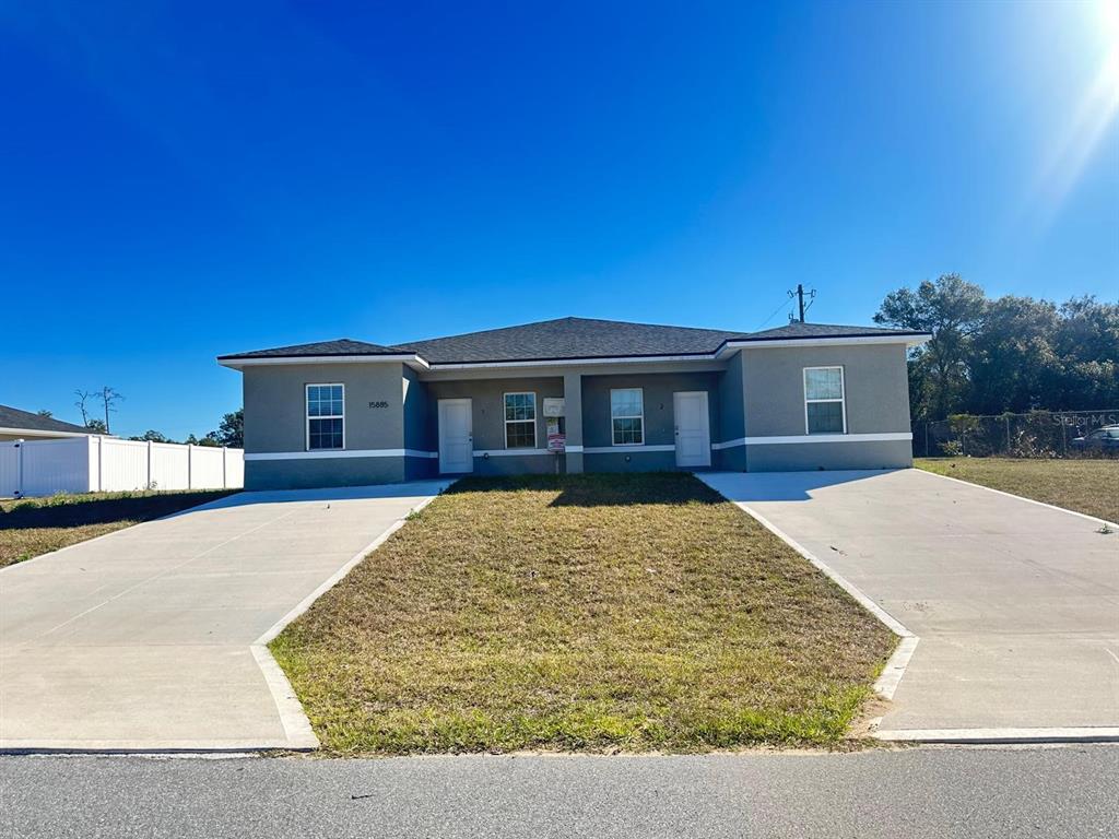 15885 Southwest 35th Court Road, Unit 1 Ocala, FL 34473 - Photo 3 of 27 a view of house with yard