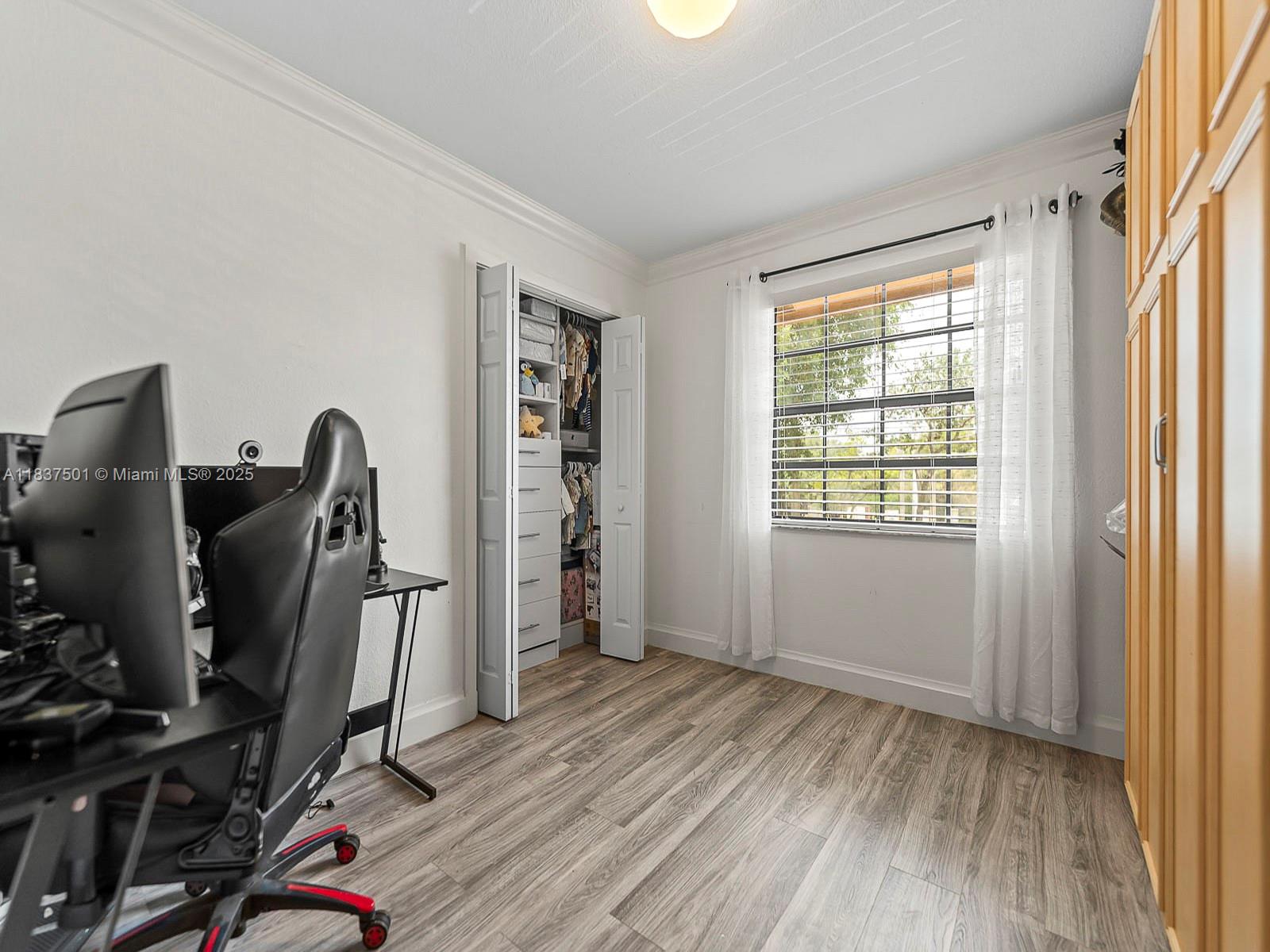 10942 West Sample Road, Unit E1 Coral Springs, FL 33065 - Photo 23 of 32 a view of a workspace with furniture and a window