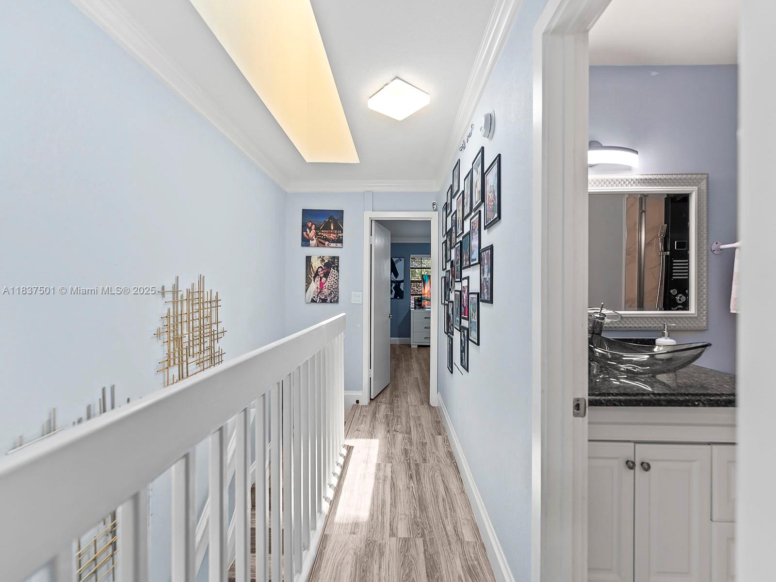 10942 West Sample Road, Unit E1 Coral Springs, FL 33065 - Photo 25 of 32 a view of a hallway view with staircase