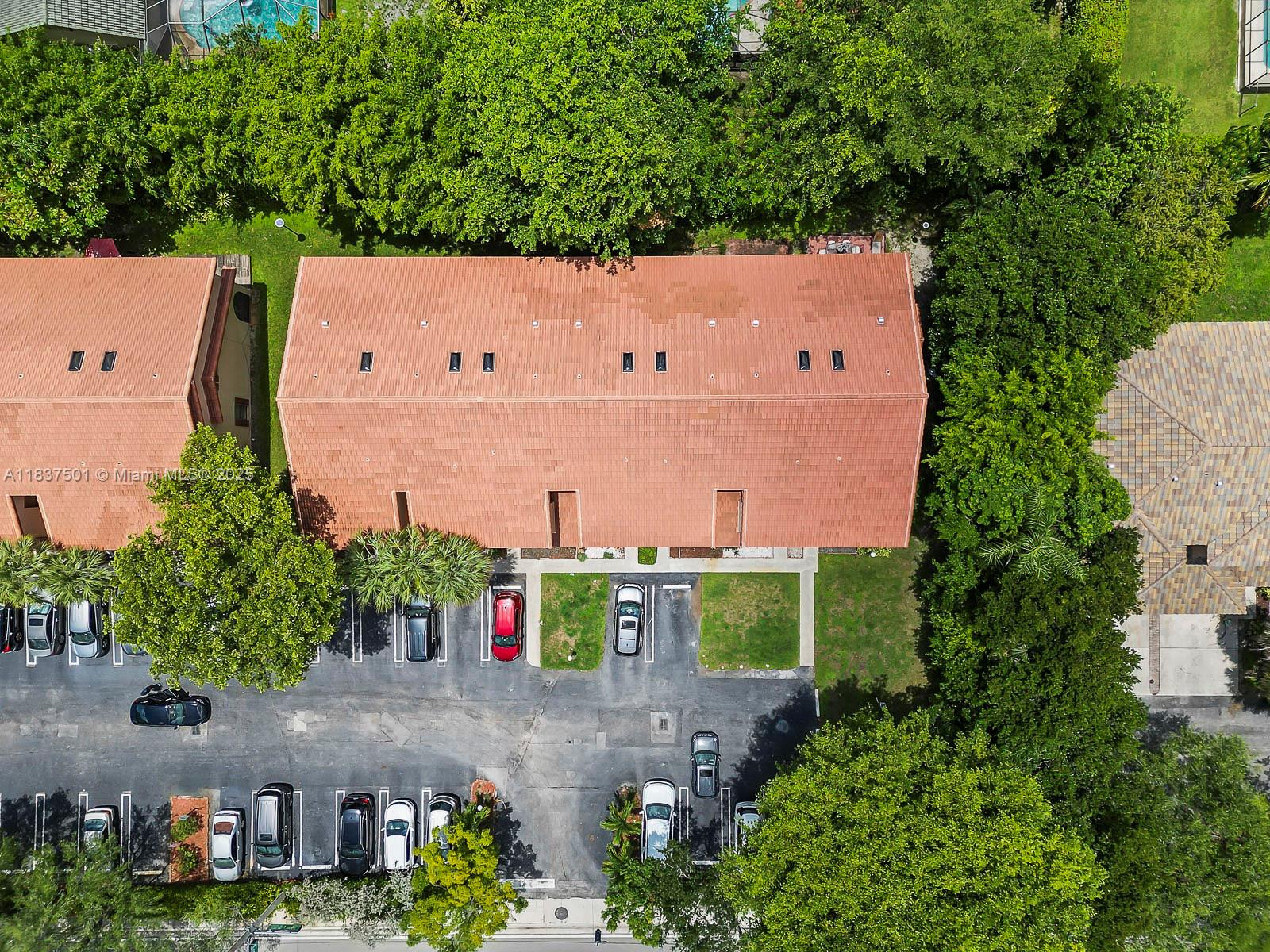 10942 West Sample Road, Unit E1 Coral Springs, FL 33065 - Photo 26 of 32 an aerial view of a house with a yard