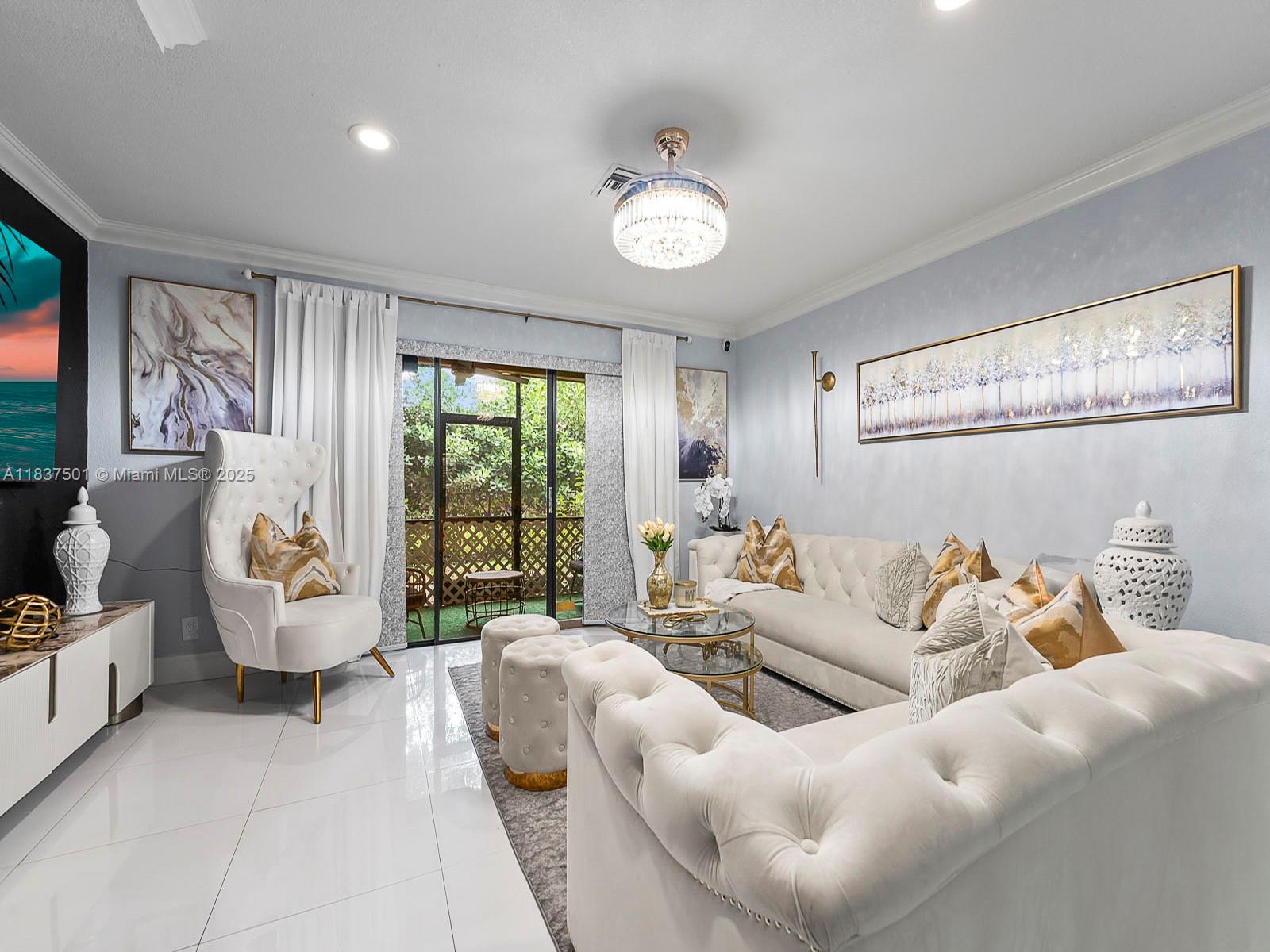 10942 West Sample Road, Unit E1 Coral Springs, FL 33065 - Photo 5 of 32 a living room with furniture and a large window