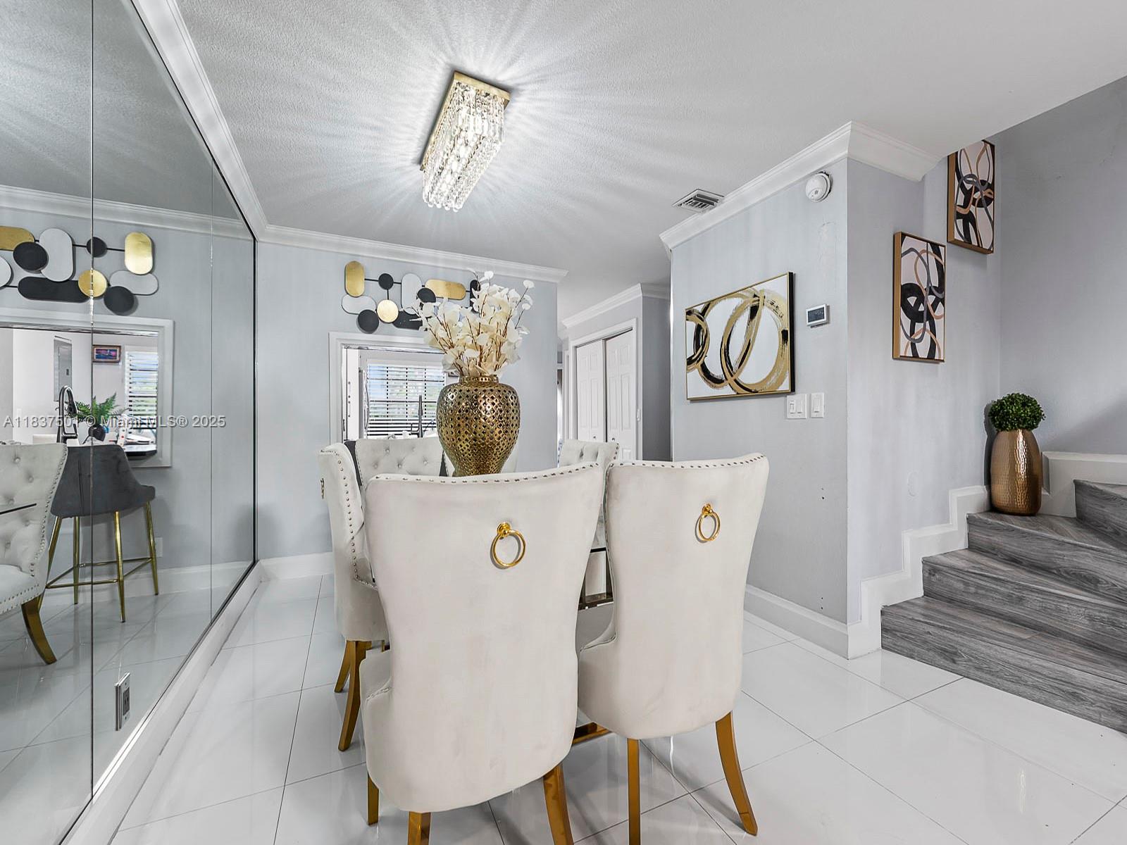 10942 West Sample Road, Unit E1 Coral Springs, FL 33065 - Photo 8 of 32 a view of dining room with furniture and wooden floor