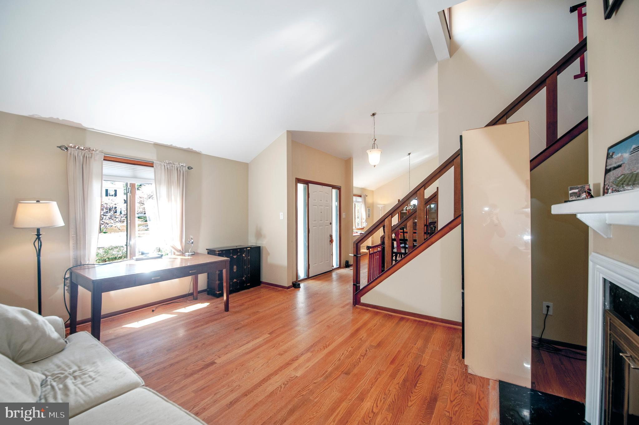 513 Flora Circle Springfield, PA 19064 - Photo 4 of 28 a living room with furniture and a wooden floor