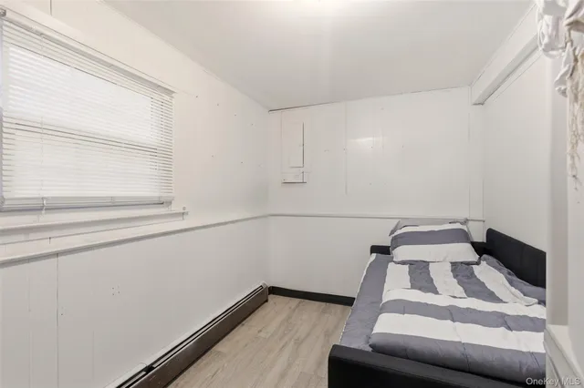 a view of a room with rack on the wall and a window