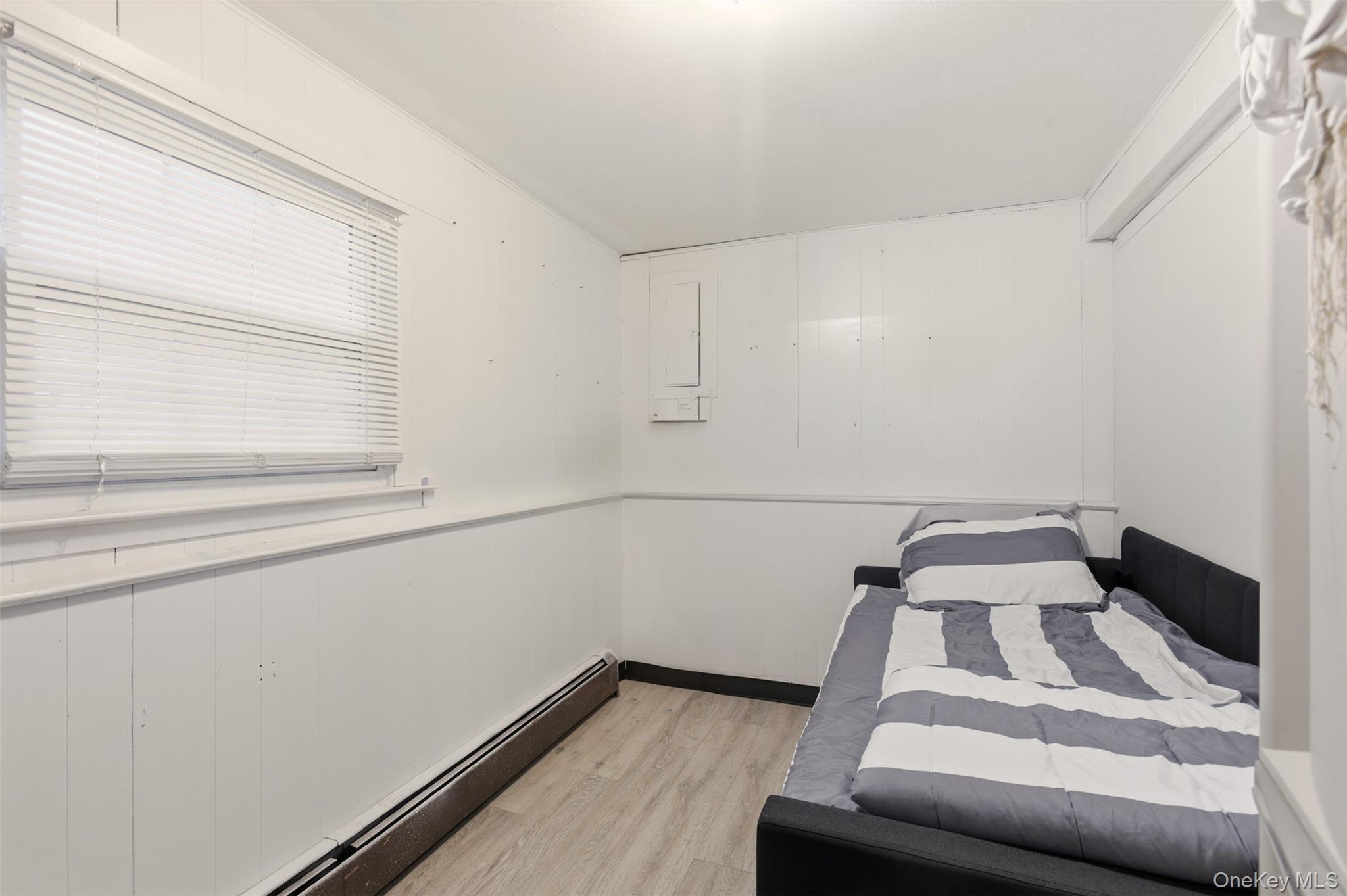 7 Jacqueline Road Monsey, NY 10952 - Photo 12 of 19 a view of a room with rack on the wall and a window