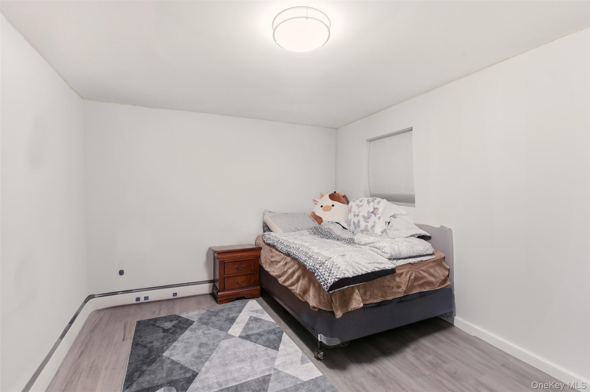 7 Jacqueline Road Monsey, NY 10952 - Photo 13 of 19 a bedroom with a bed and a window