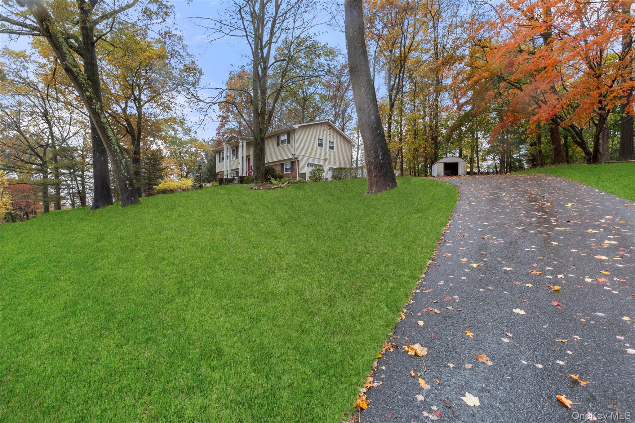 7 Jacqueline Road Monsey, NY 10952 - Photo 19 of 19 a view of a white house with a big yard and large trees