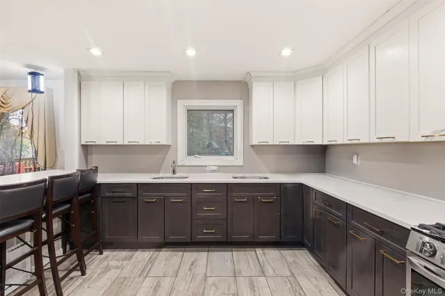 a kitchen with a sink stove and cabinets