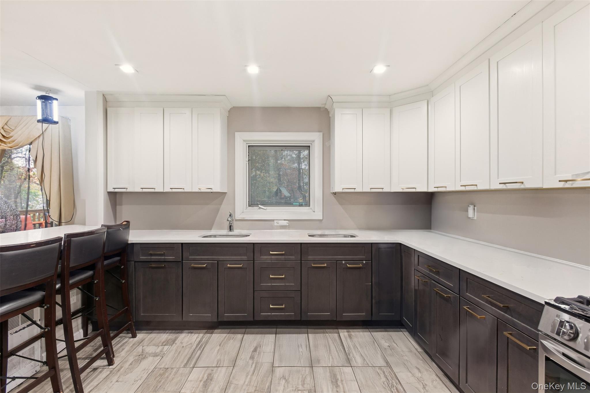 7 Jacqueline Road Monsey, NY 10952 - Photo 3 of 19 a kitchen with a sink stove and cabinets
