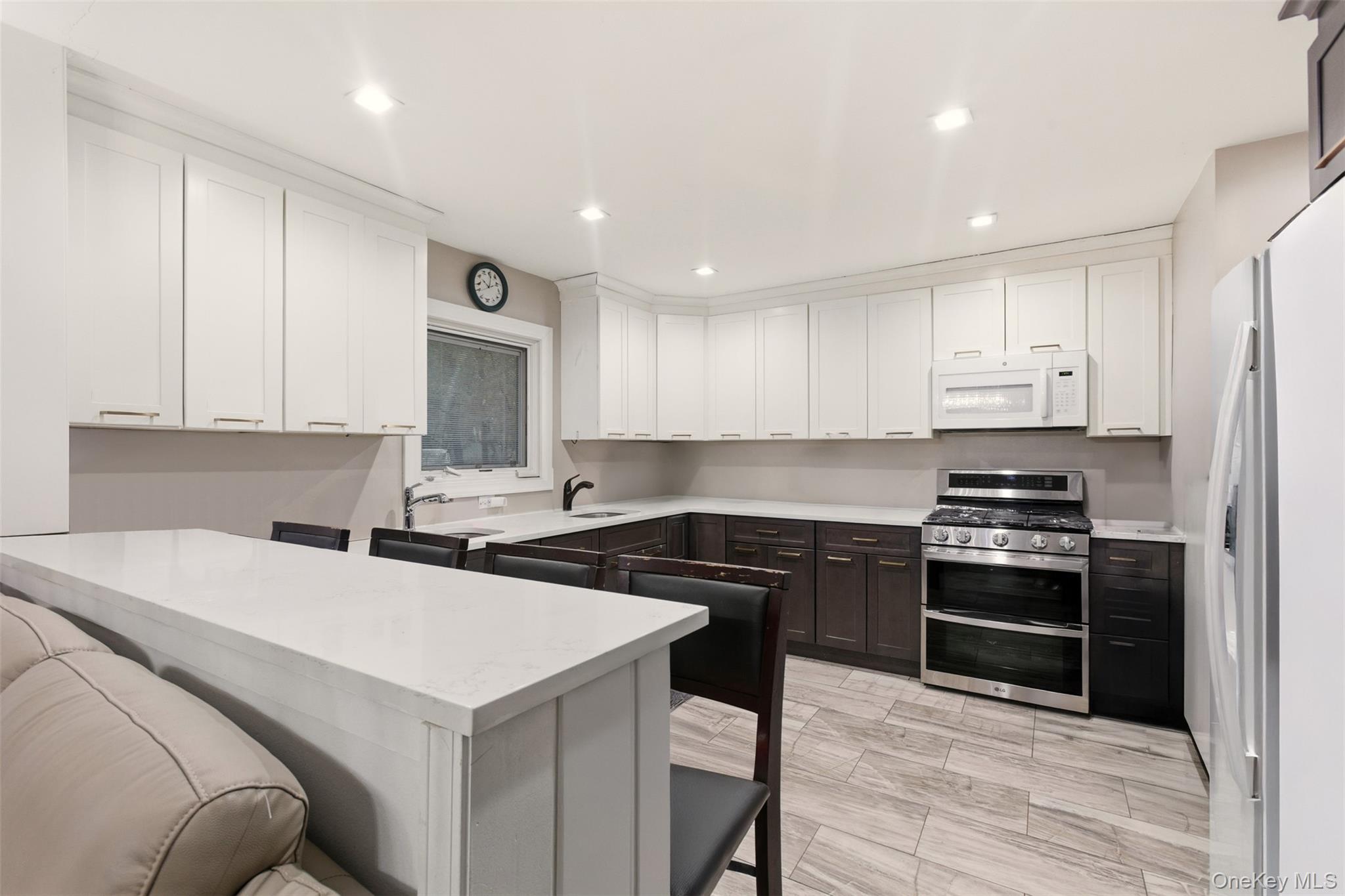 7 Jacqueline Road Monsey, NY 10952 - Photo 4 of 19 a kitchen that has a sink and a stove in it