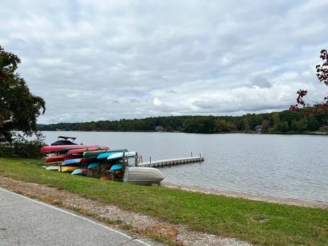a view of house with outdoor space and lake view