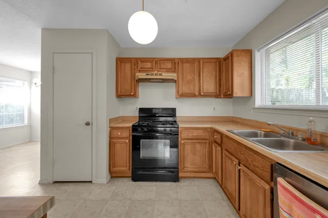 a kitchen with a stove and a sink