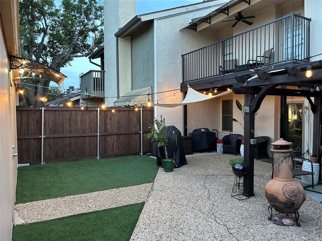 9446 Chimney Corner Dallas, TX 75243 - Photo 14 of 15 a view of a chairs and table in backyard
