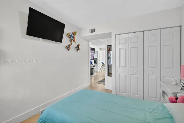 a view of a livingroom with an empty space and a window