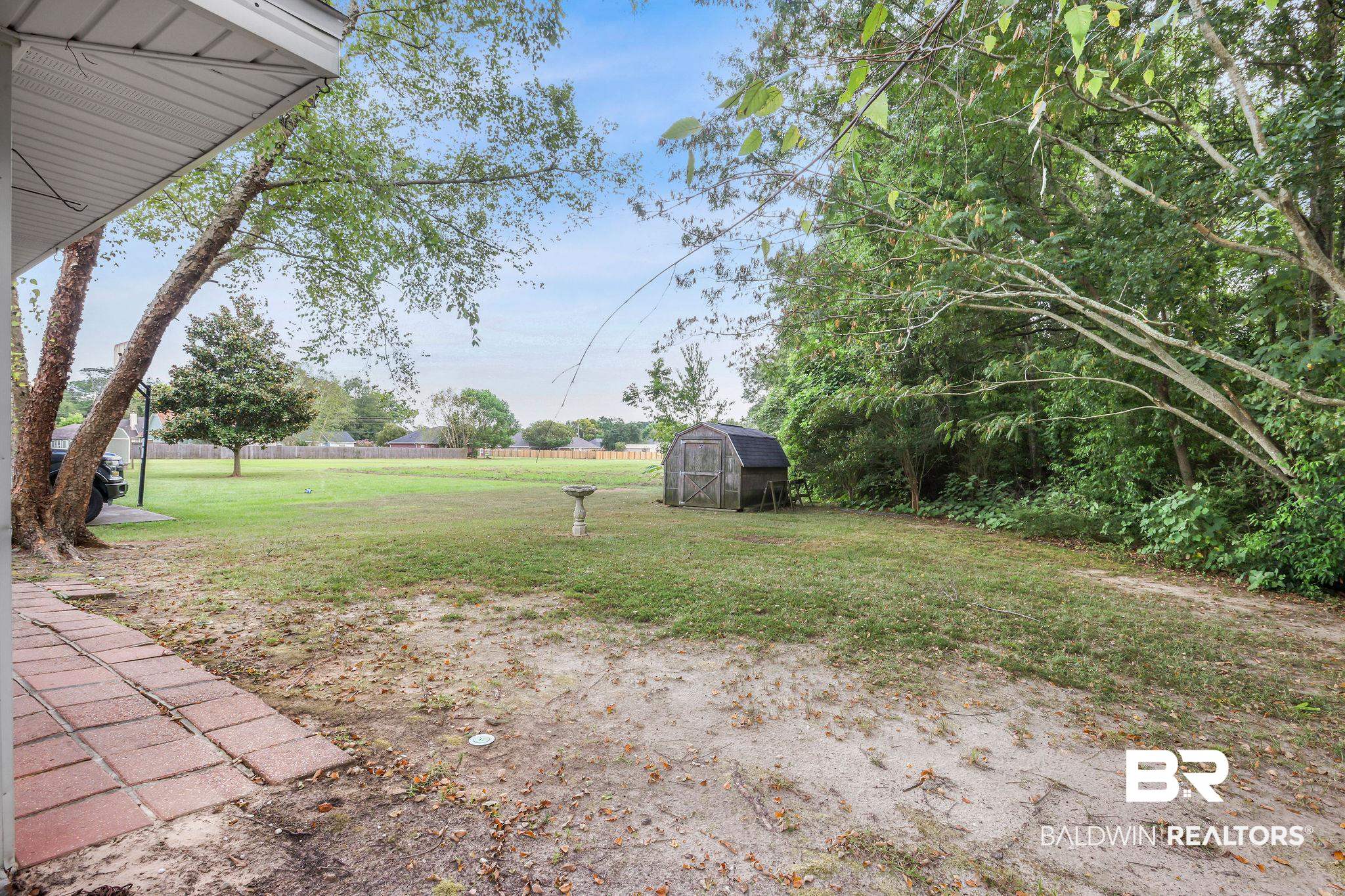 18620 Hammond Street Robertsdale, AL 36567 - Photo 22 of 23 View of yard with an outbuilding