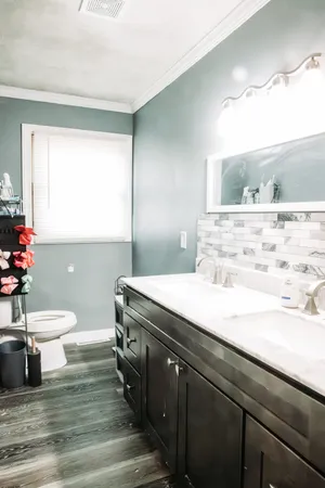 a bathroom with a sink and a mirror