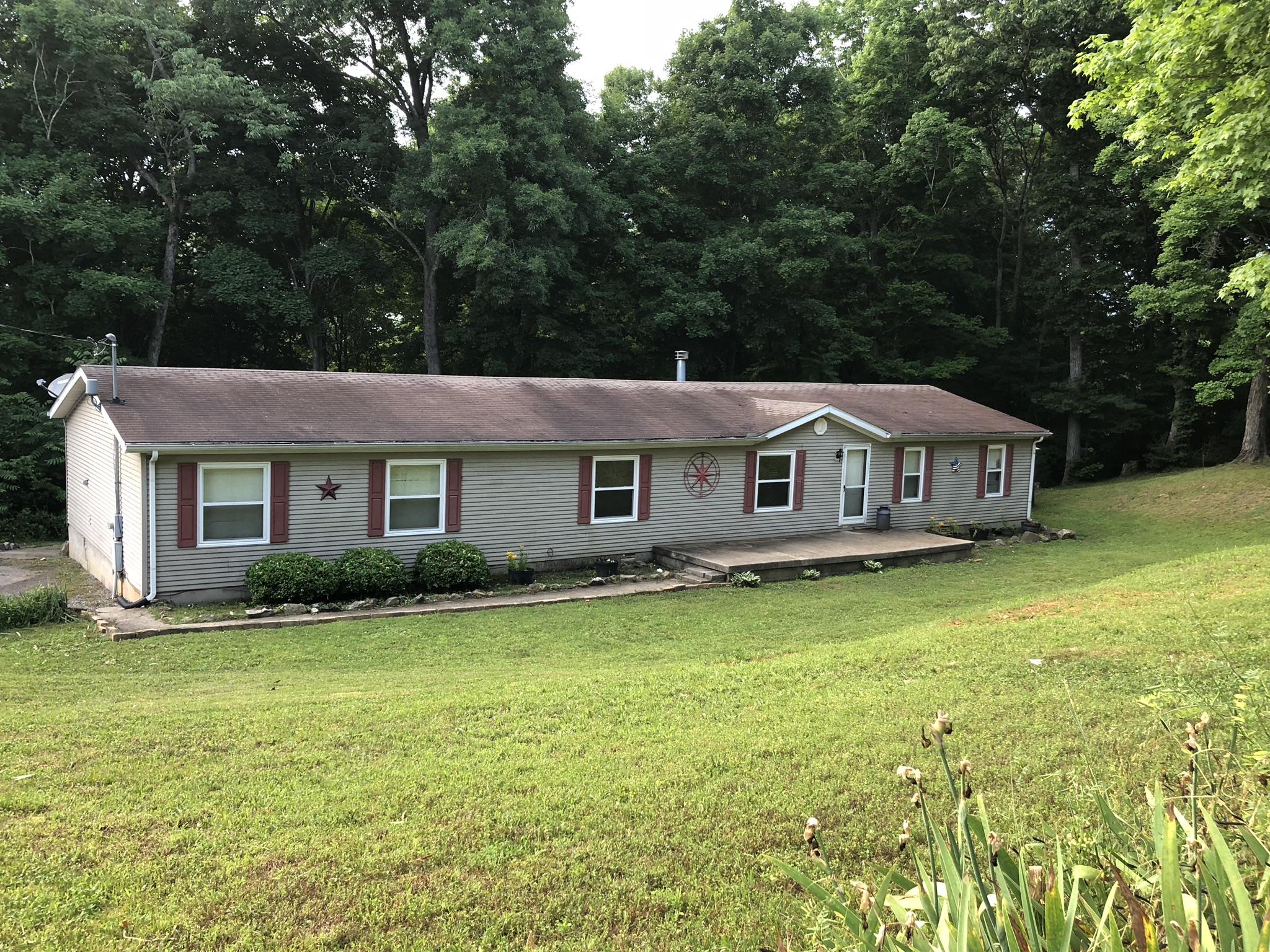 399 Brock Road Charlotte, TN 37036 - Photo 1 of 22 Welcome home to 399 Brock Rd! This home sits on a 5 acre lot and feels like you are in Gatlinburg!