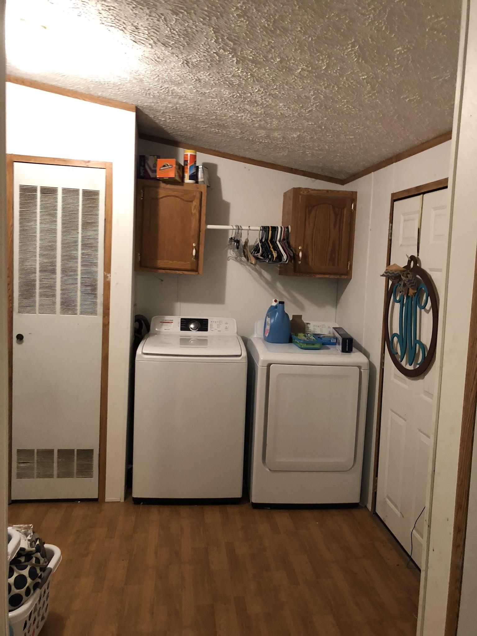 399 Brock Road Charlotte, TN 37036 - Photo 13 of 22 Separate laundry room. There is also a half bath in here too!