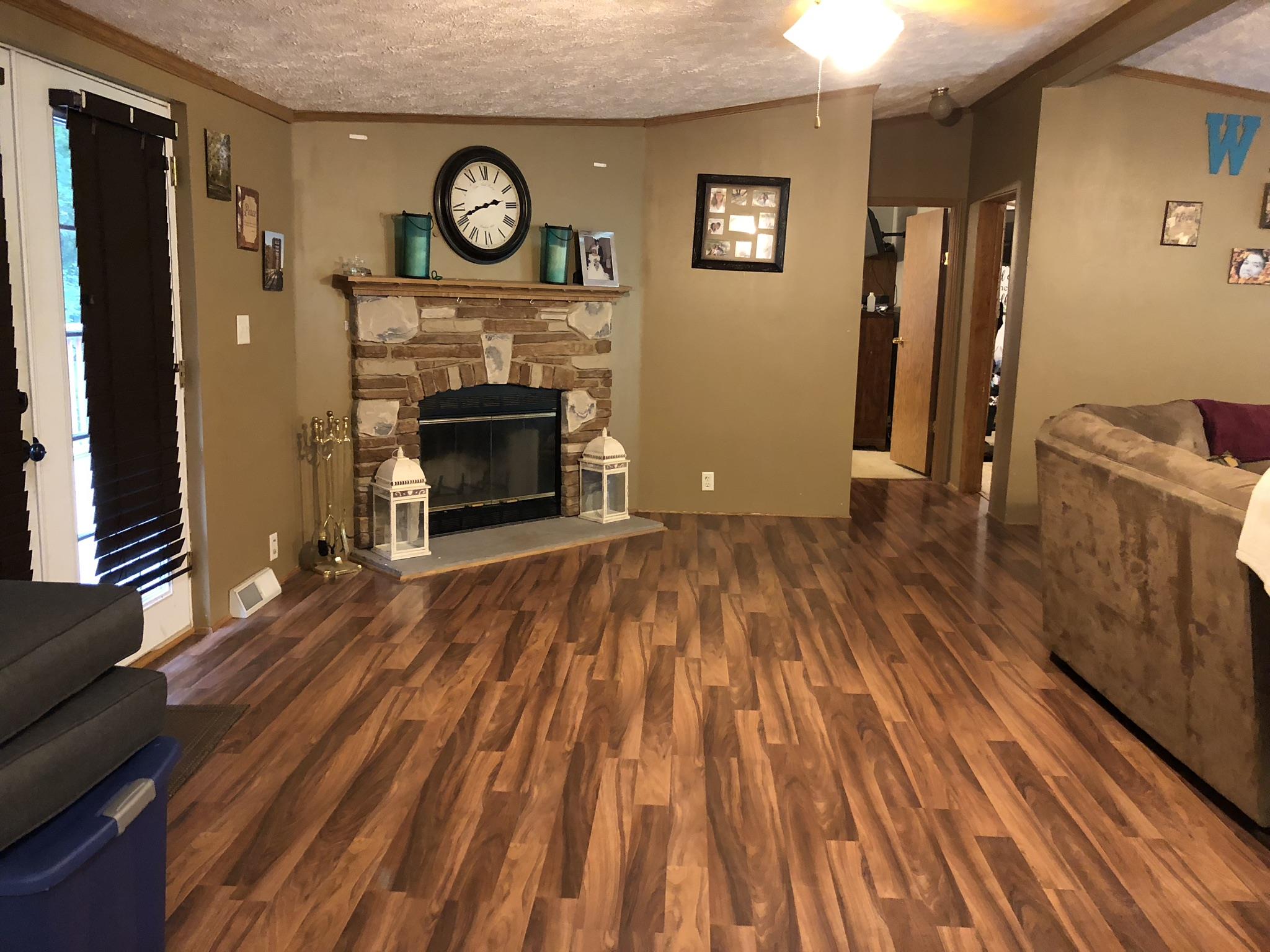 399 Brock Road Charlotte, TN 37036 - Photo 4 of 22 Lovely updated flooring throughout the main living area!