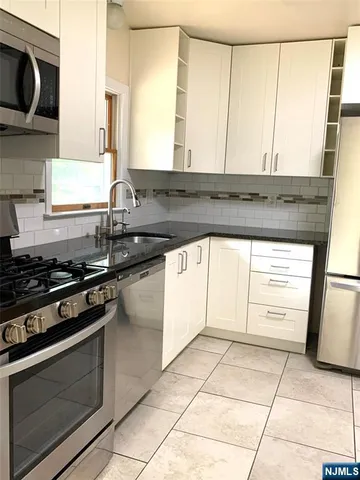 a kitchen with a stove and a microwave