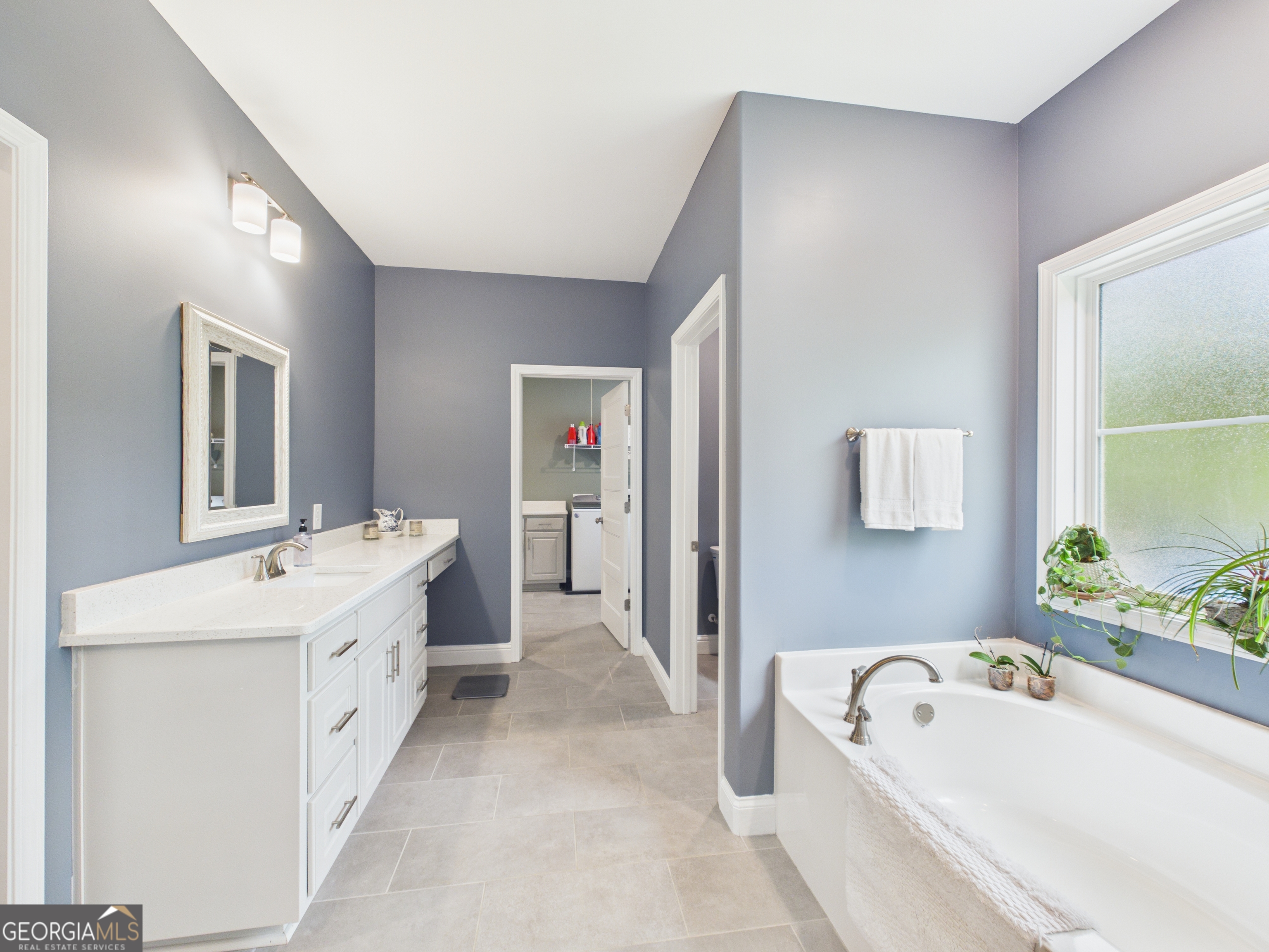 143 Terry Lane Fortson, GA 31808 - Photo 20 of 46 a bathroom with a tub sink and mirror