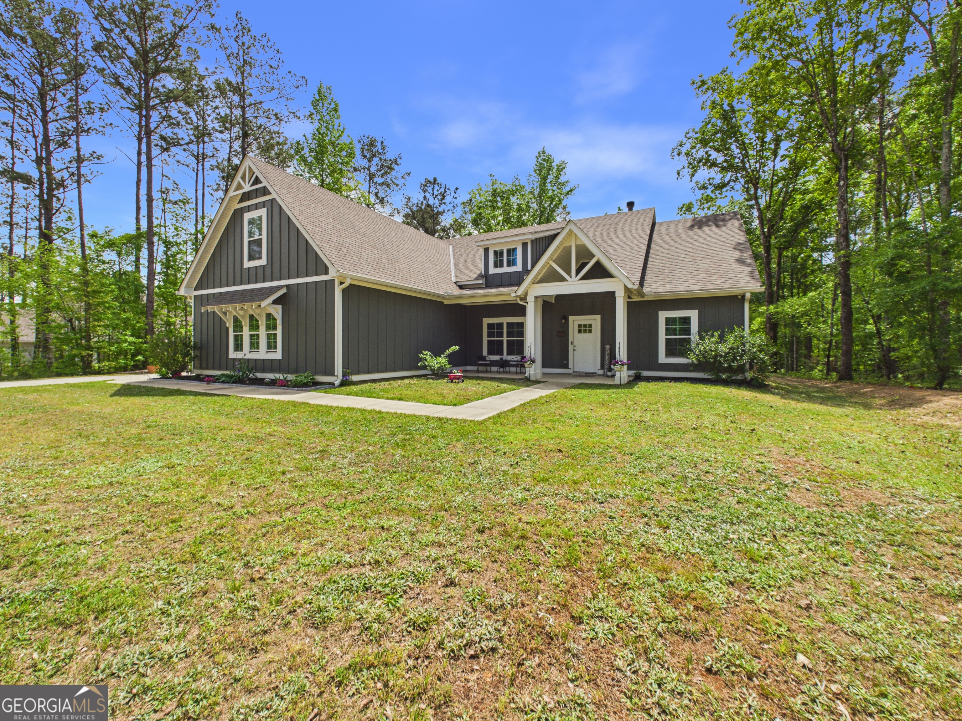 143 Terry Lane Fortson, GA 31808 - Photo 2 of 46 a front view of a house with a yard