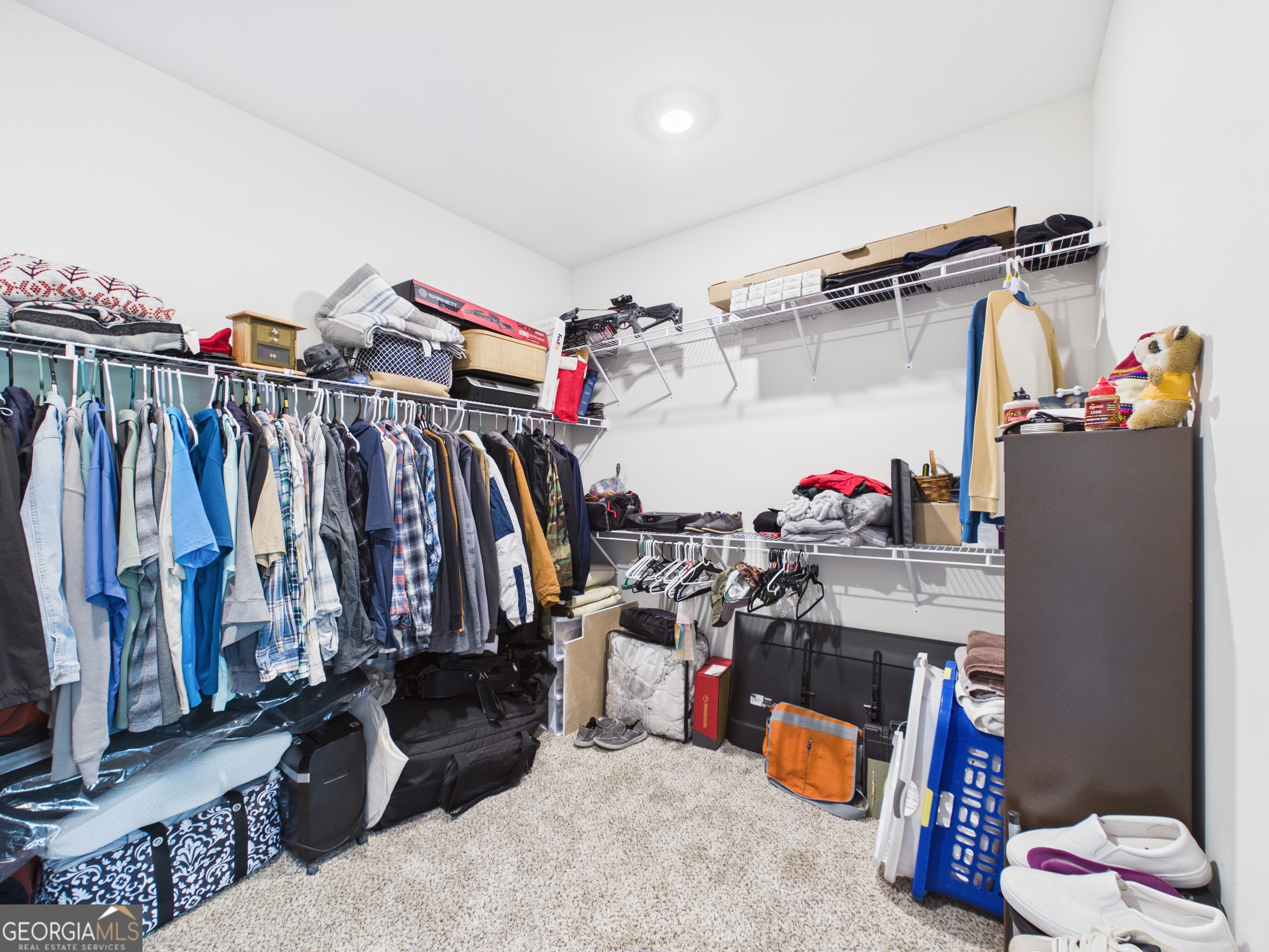 143 Terry Lane Fortson, GA 31808 - Photo 23 of 46 a view of walk in closet with clothes and shoes