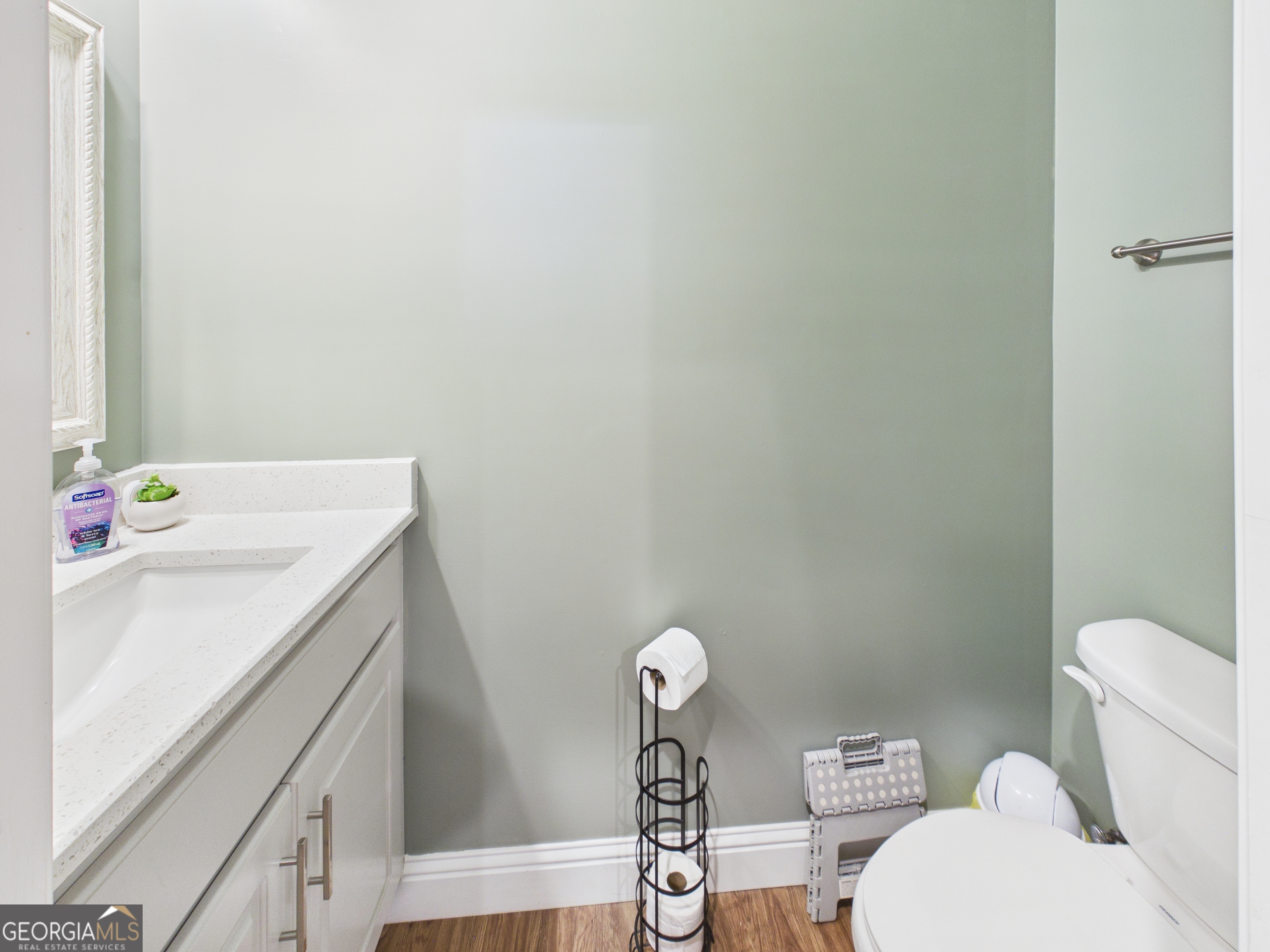 143 Terry Lane Fortson, GA 31808 - Photo 26 of 46 a bathroom with a sink a toilet and shower curtain