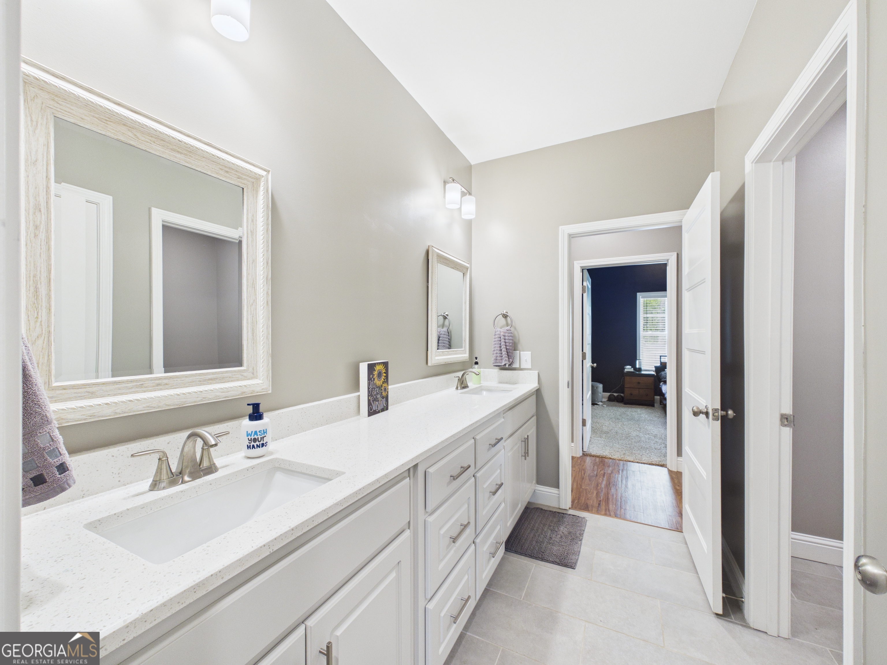 143 Terry Lane Fortson, GA 31808 - Photo 33 of 46 a spacious bathroom with a double vanity sink mirror and double