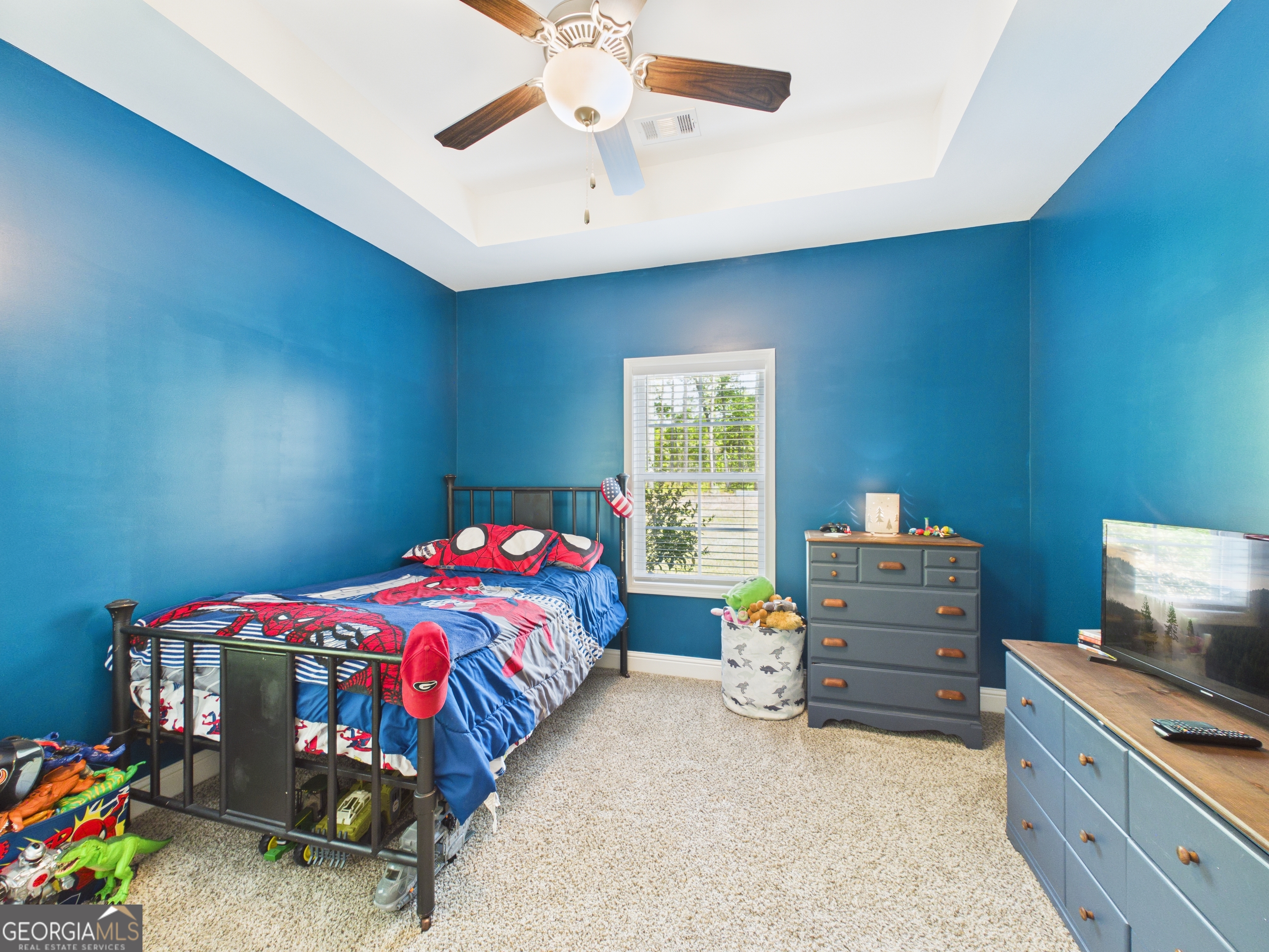 143 Terry Lane Fortson, GA 31808 - Photo 37 of 46 a bedroom with a bed and a window