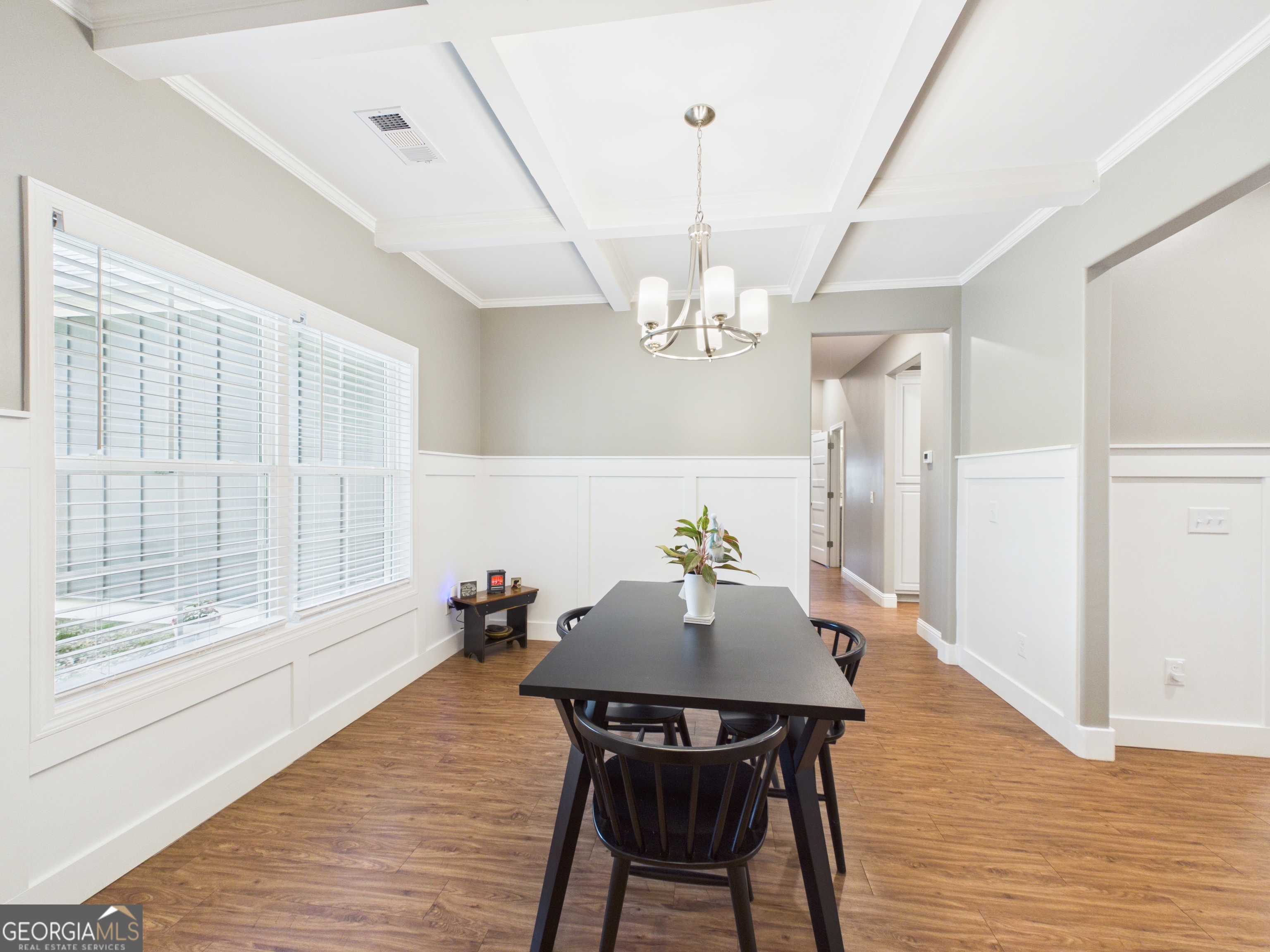 143 Terry Lane Fortson, GA 31808 - Photo 9 of 46 a view of a dining room with furniture a chandelier and wooden floor