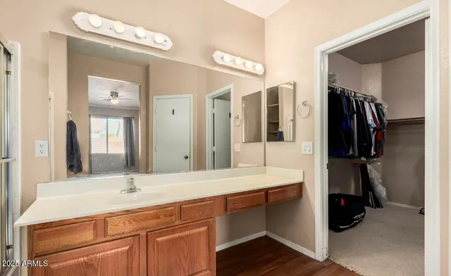 a bathroom with a double vanity sink and a mirror