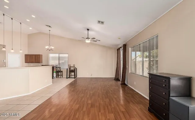 a view of a kitchen with wooden floor and a kitchen