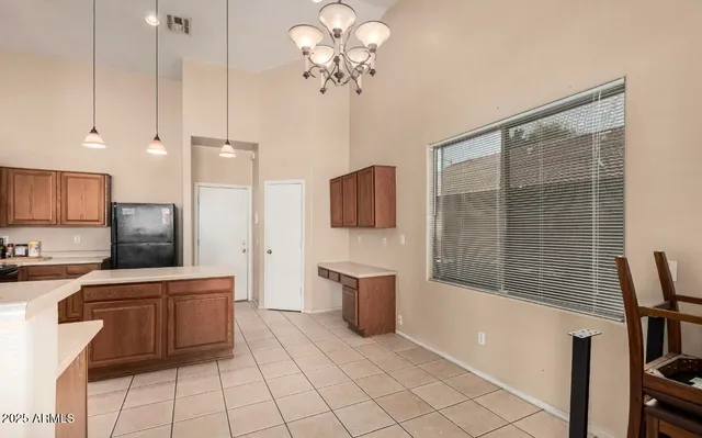a kitchen with stainless steel appliances a stove a sink and a refrigerator