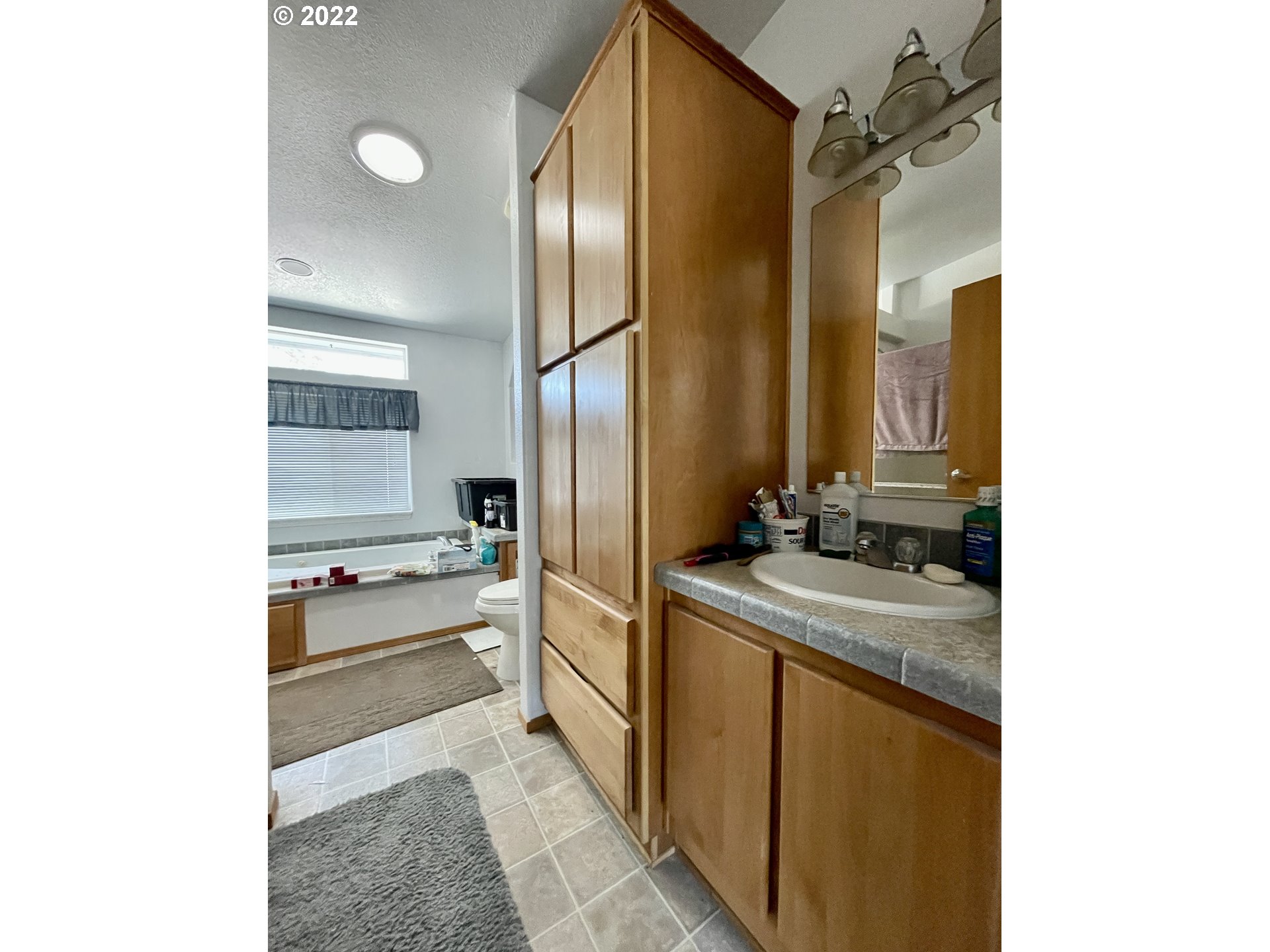 307 Evergreen Ridge Road Riddle, OR 97469 - Photo 13 of 29 a kitchen with a sink and refrigerator
