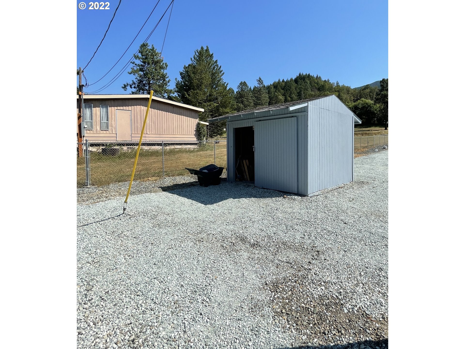 307 Evergreen Ridge Road Riddle, OR 97469 - Photo 23 of 29 a view of a house with a backyard