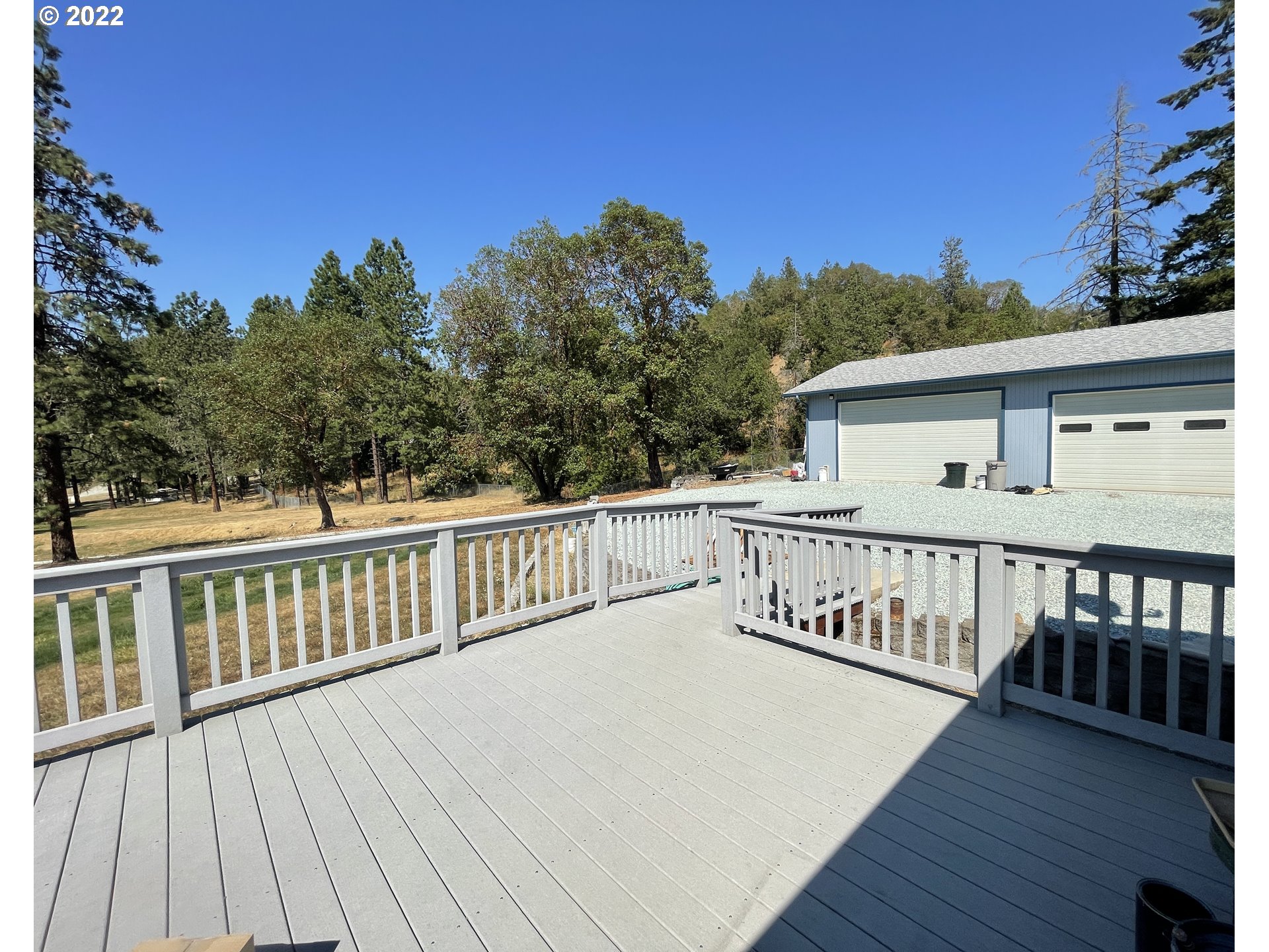 307 Evergreen Ridge Road Riddle, OR 97469 - Photo 28 of 29 a view of a wooden deck with a yard