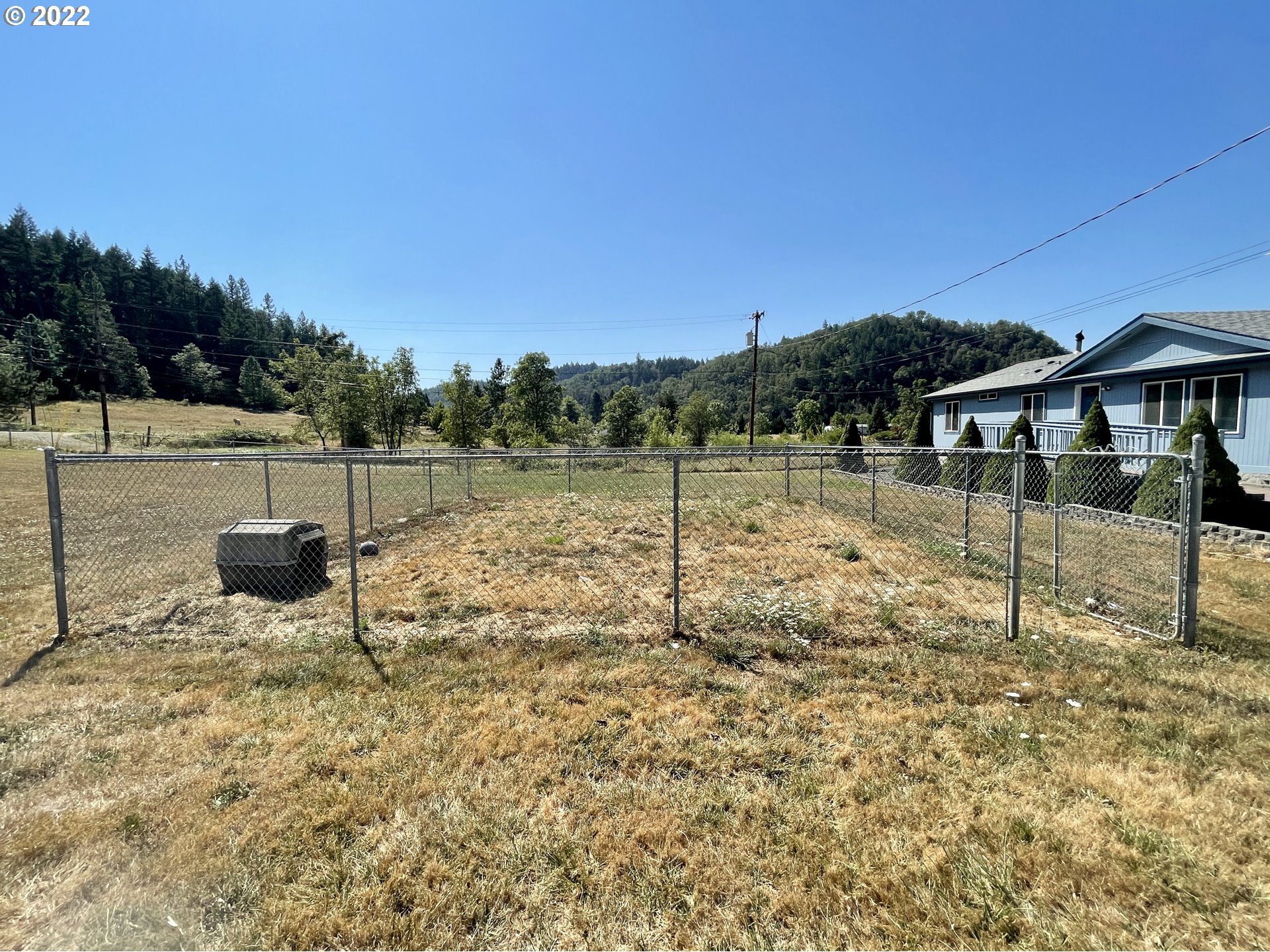 307 Evergreen Ridge Road Riddle, OR 97469 - Photo 4 of 29 a view of a lake with a mountain