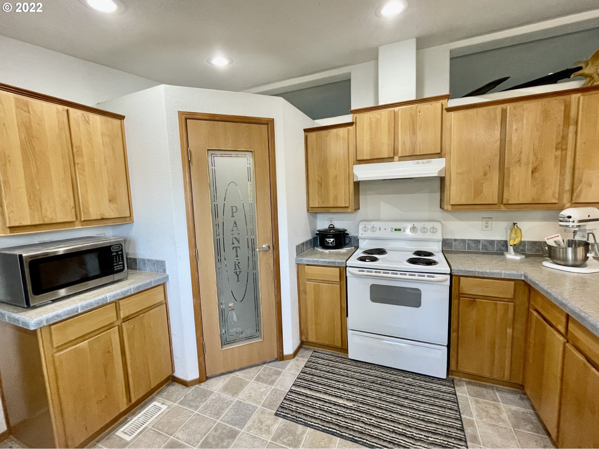 307 Evergreen Ridge Road Riddle, OR 97469 - Photo 7 of 29 a kitchen with a sink stove and refrigerator