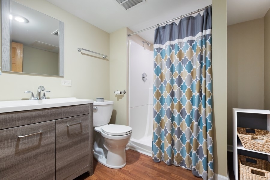 709 South Anderson Road New Lenox, IL 60451 - Photo 23 of 28 a bathroom with a sink toilet and shower