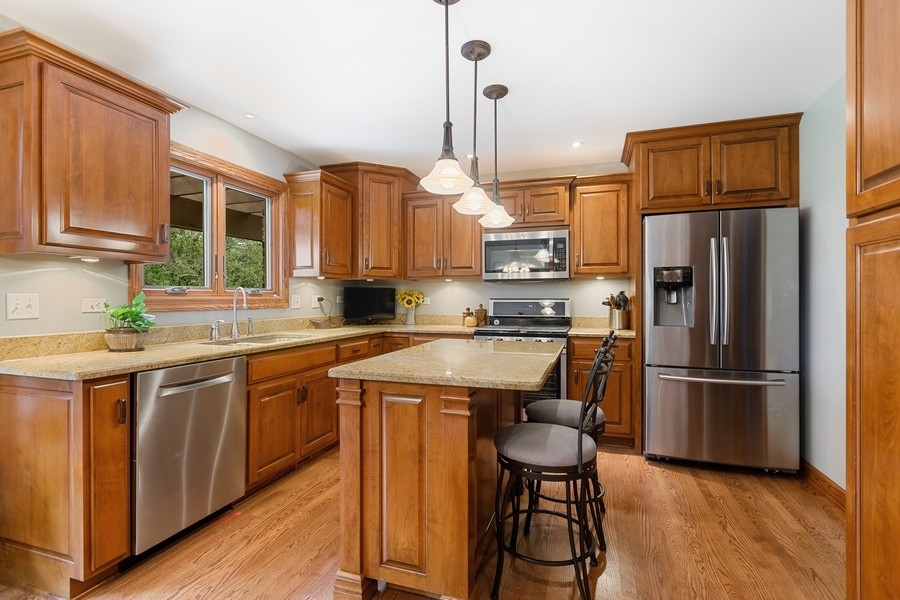 709 South Anderson Road New Lenox, IL 60451 - Photo 5 of 28 a kitchen with appliances cabinets and a sink