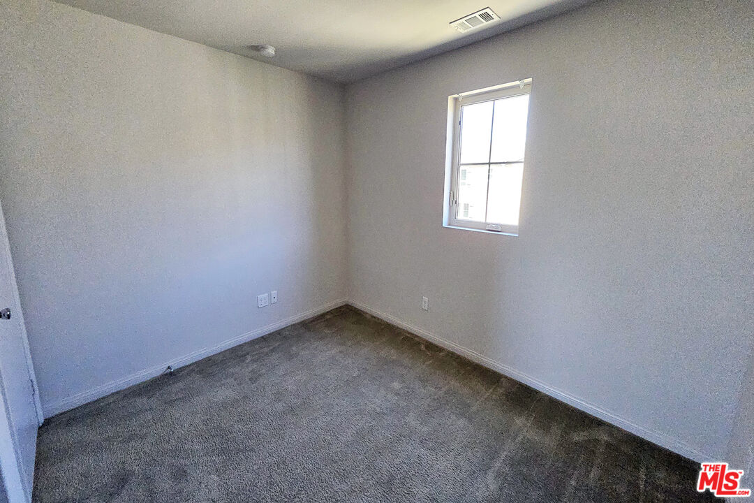 7245 Maple Road Van Nuys, CA 91405 - Photo 15 of 45 an empty room with a window