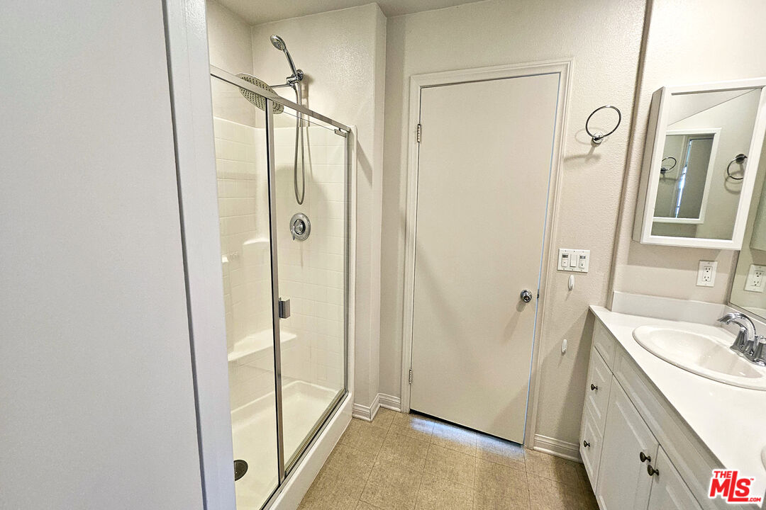7245 Maple Road Van Nuys, CA 91405 - Photo 20 of 45 a bathroom with a shower and a sink