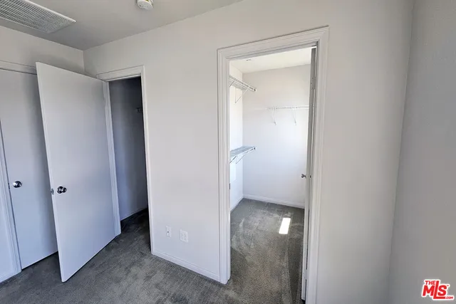 a view of a hallway with closet