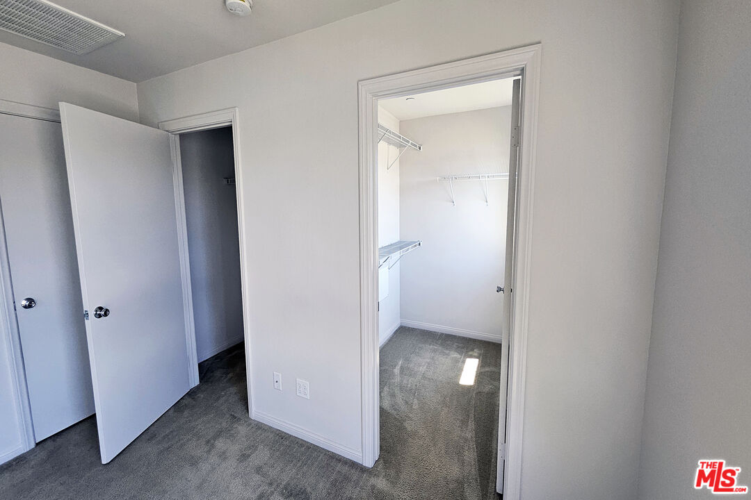 7245 Maple Road Van Nuys, CA 91405 - Photo 25 of 45 a view of a hallway with closet