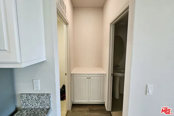 a view of an entryway with wooden floor