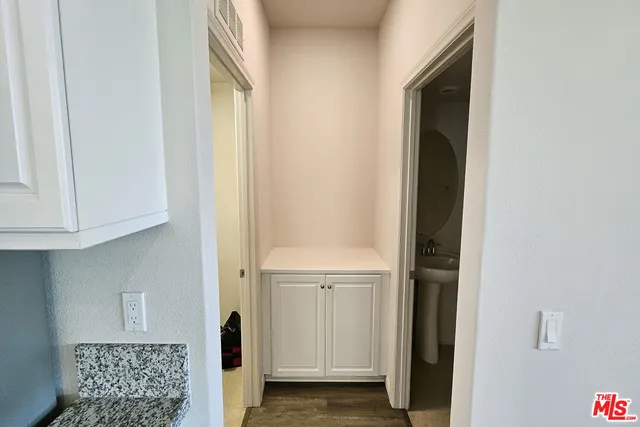 a view of an entryway with wooden floor