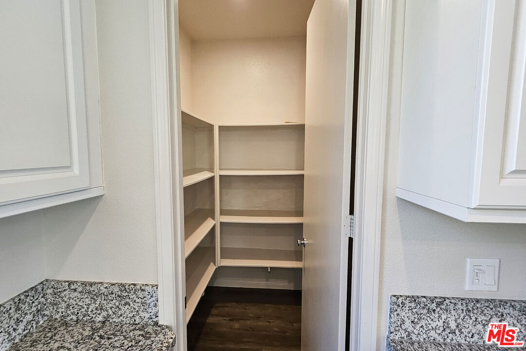 7245 Maple Road Van Nuys, CA 91405 - Photo 35 of 45 a view of walk in closet with empty racks
