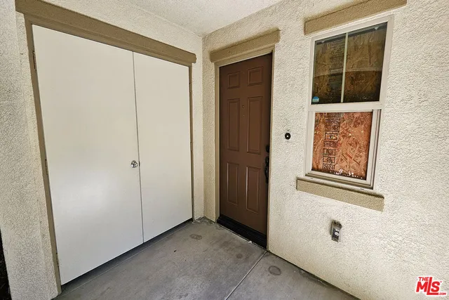 a view of a door and a window