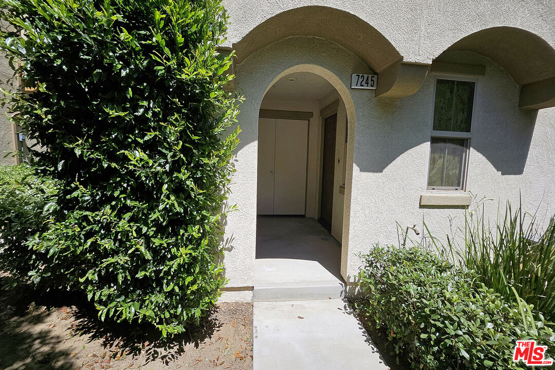 7245 Maple Road Van Nuys, CA 91405 - Photo 41 of 45 a front view of a house with a garden
